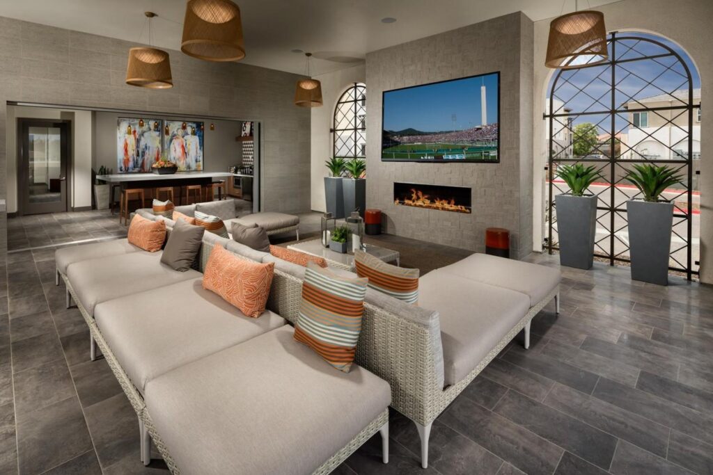 Clubhouse with a huge sitting area, TV and tall planters