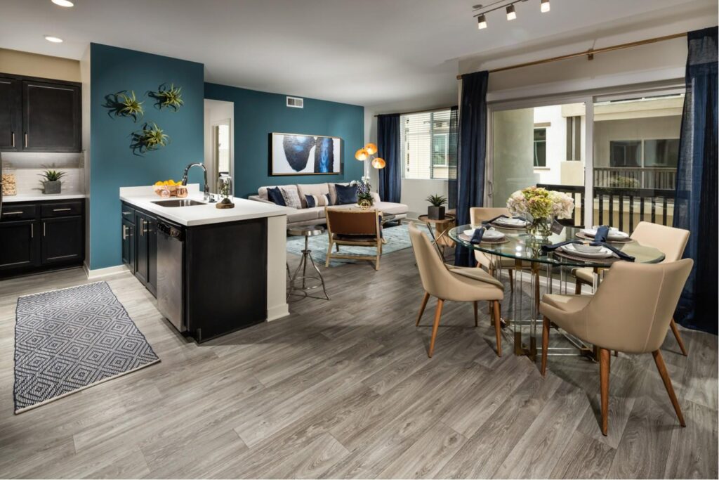 Open-concept kitchen, living, and dining room in a one-bedroom Temecula apartment at Solaire
