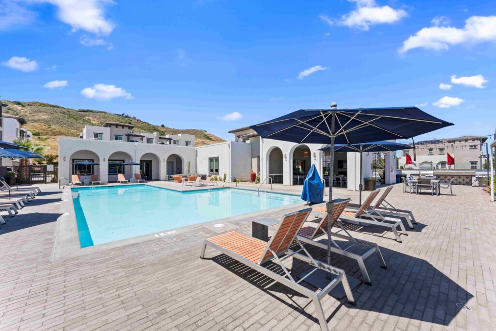 View of the pool and clubhouse at Solaire luxury apartments in Temecula