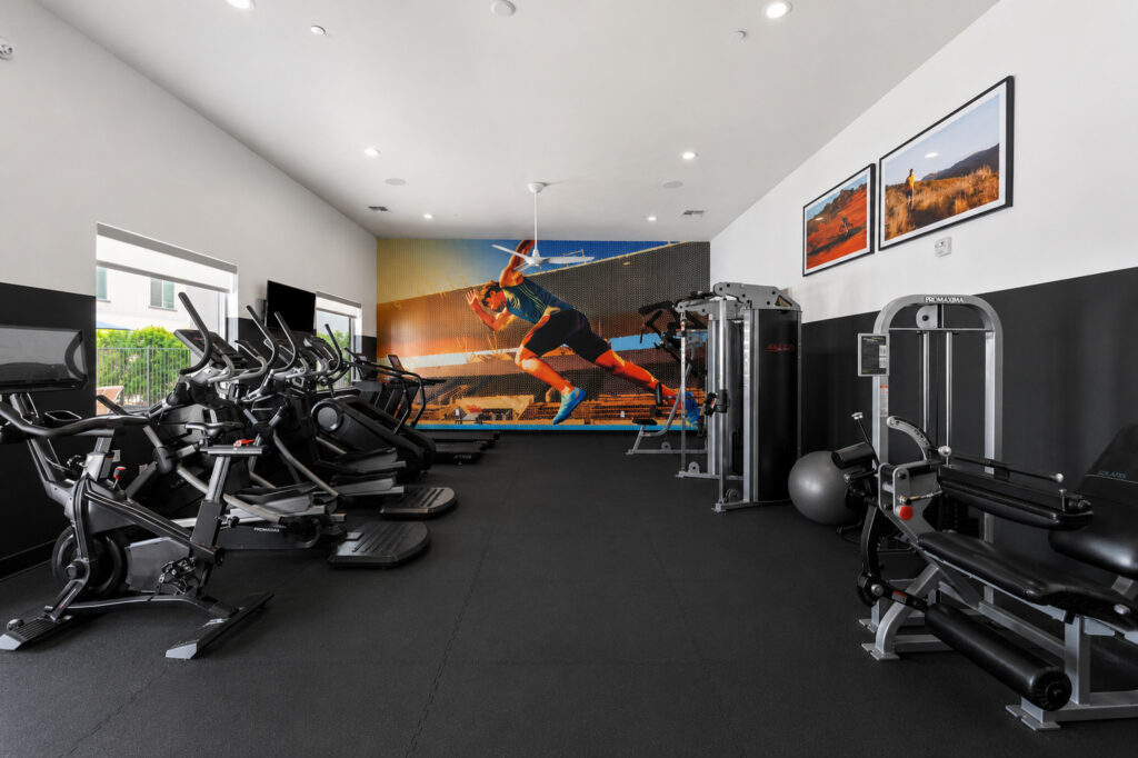 fitness center with modern equipment for cardio and some weights